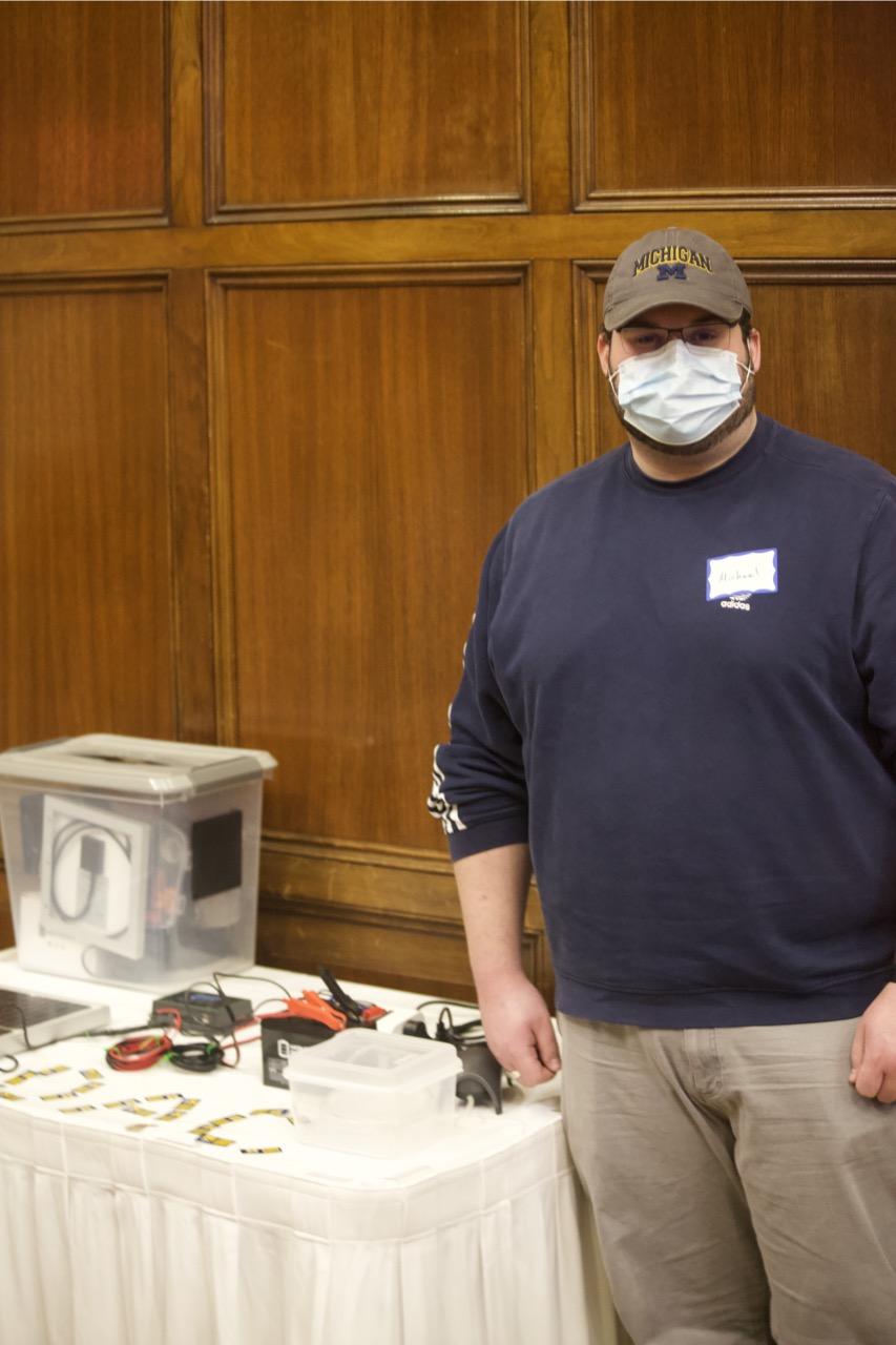 UM alum, Michael Ficaj, presents a Direct Air Capture (DAC) device that was created in a collaborative effort with fellow student Daniel Pert. This device will be featured at the 'Carbon Capture and Conversion' exhibit on display at Matthaei Botanical Gardens.