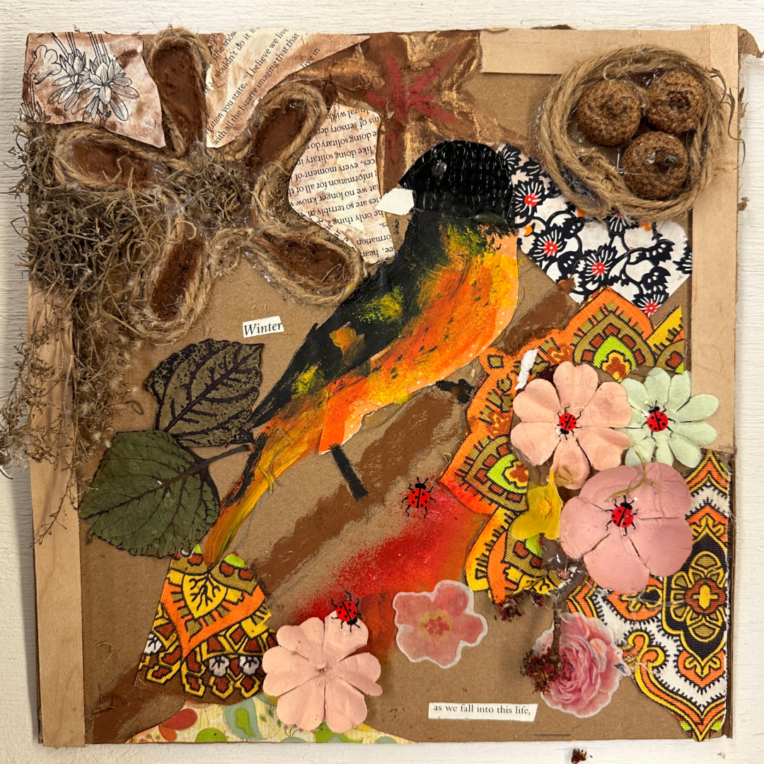 Natural materials art collage with a robin and flowers shown