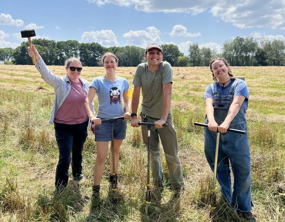 four people in a field