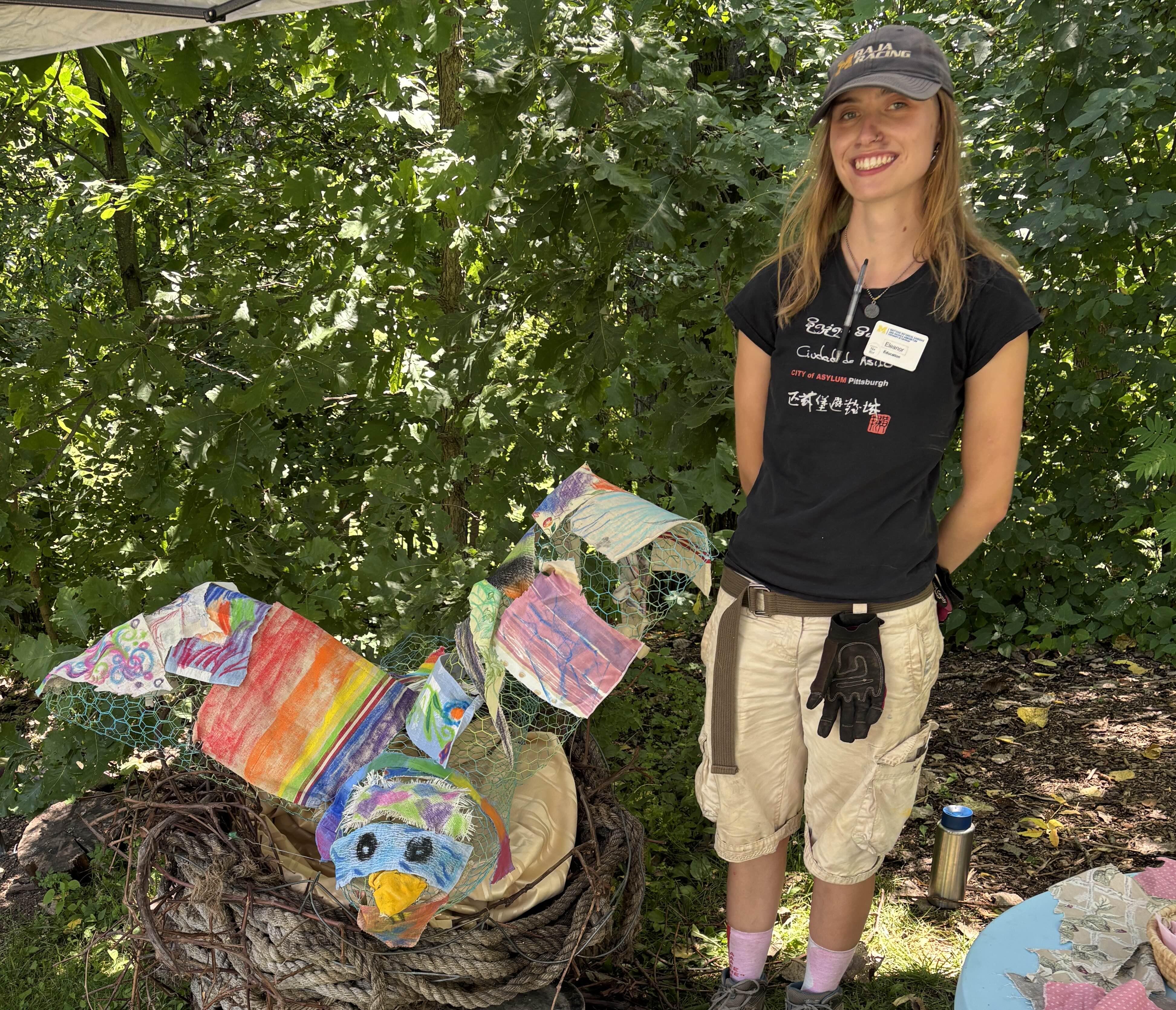 Eleanor Schlick with a crafted nature art bird