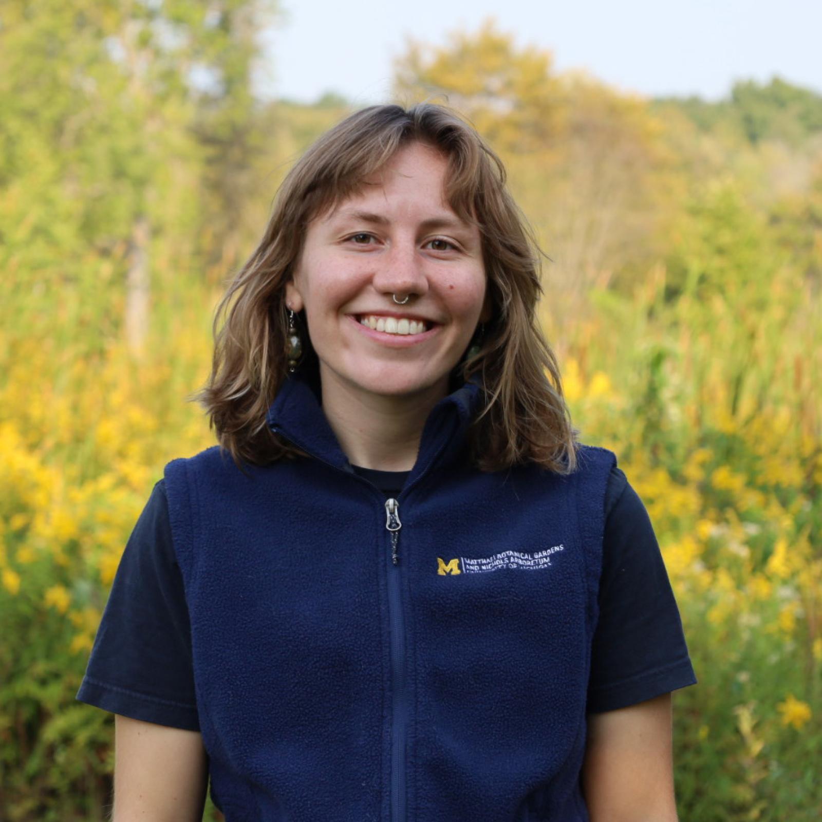 Mary Debona smiles while standing outside