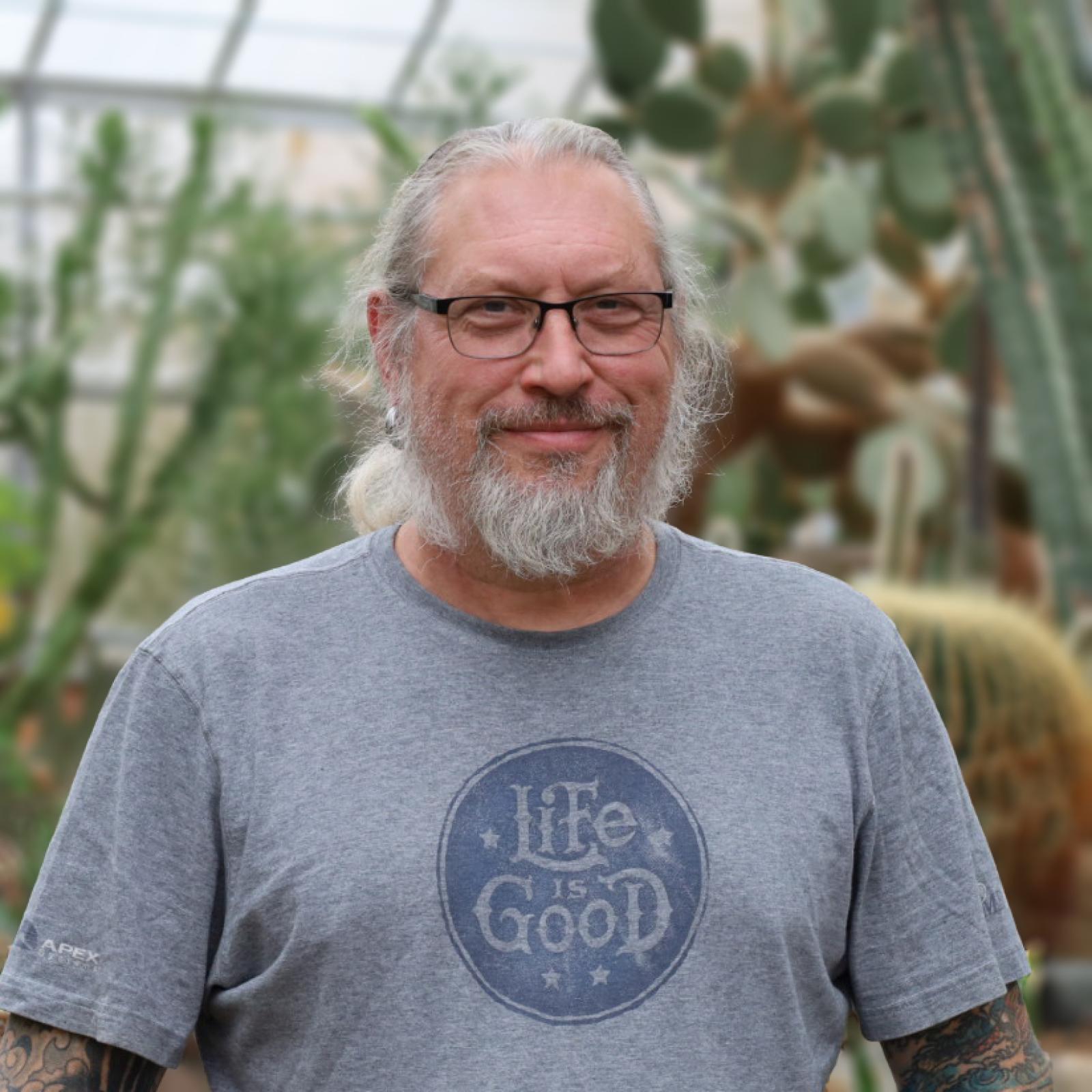 Mike Bruneau in the conservatory arid house