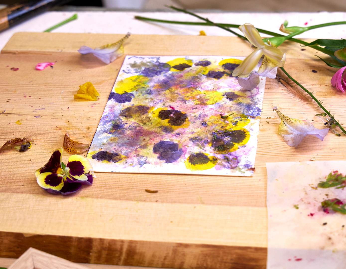 flowers pounded into paper for design 