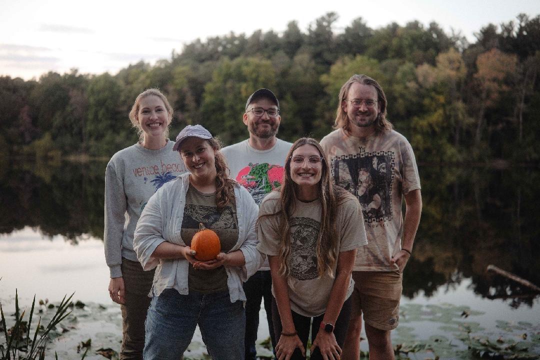 Five U-M students outside by water