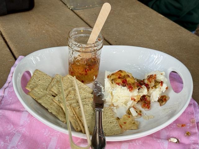hot pepper jam with creese and crackers on a plate