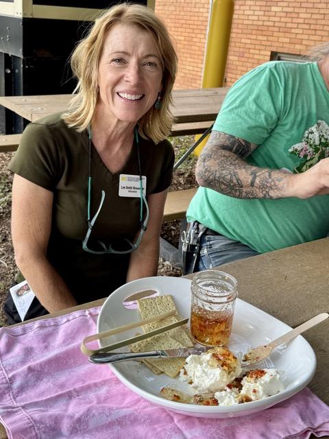 Lee at a table with her hot pepper jelly in front of her