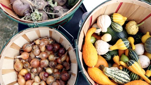 three baskets of vegetables