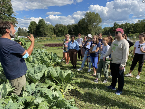 jeremy talks to group of students at the campus farm
