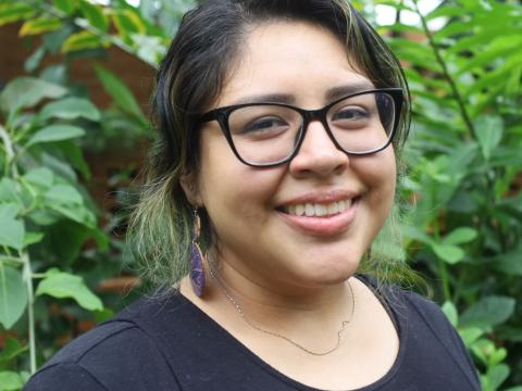 Ariana Bautista smiles in tropical house at Matthaei Botanical Gardens