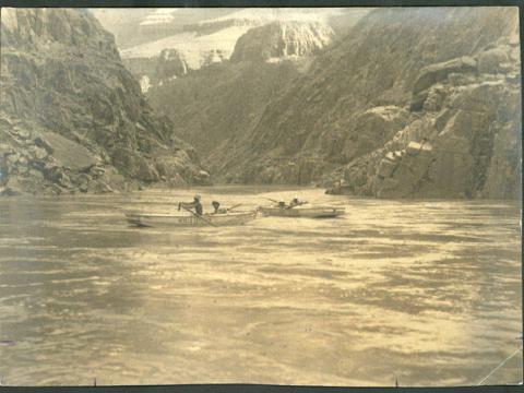 old black and white photo of boats on river