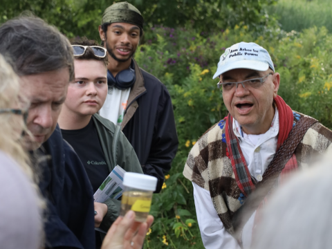 people surprised looking at water samples