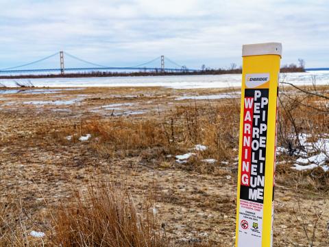 An Enbridge Energy "Warning: Petroleum Pipeline" at the site of the Line 5 oil pipeline site at the Straits of Mackinac between Lake Michigan and Lake Huron.