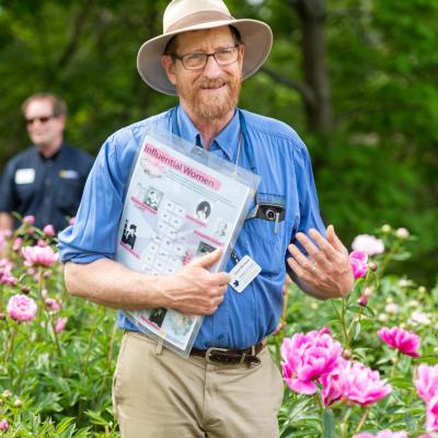 David Michener leading a tour through the peony garden in 2019. 