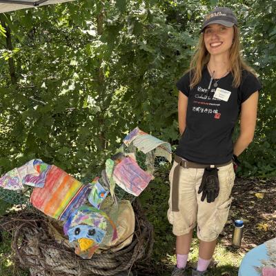 Eleanor Schlick with a crafted nature art bird