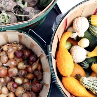 three baskets of vegetables 